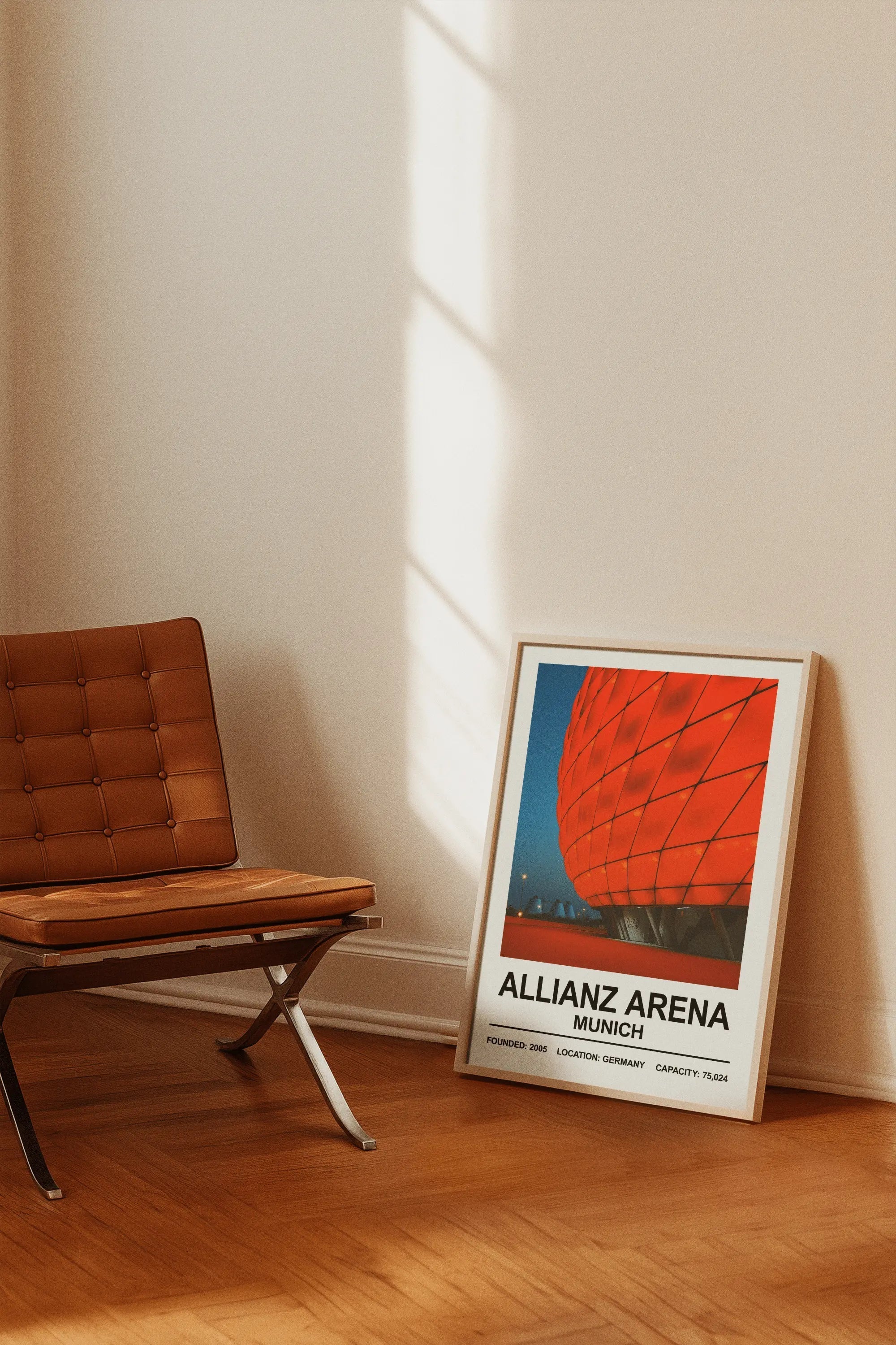 A framed poster print featuring a vibrant red geometric design of the allianz arena stadium for bayern munich fans