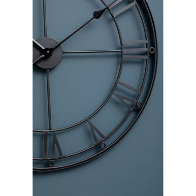 Baywood matt black metal wall clock with black metal frame, roman numerals, and slender hands in industrial style