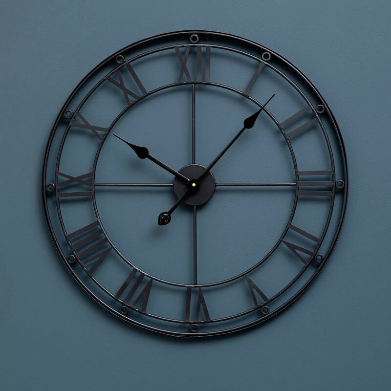 Baywood matt black metal wall clock with roman numerals and slender hands in black metal wall design