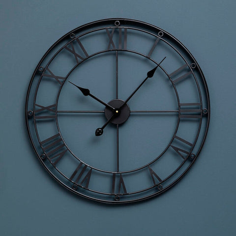 Baywood matt black metal wall clock with roman numerals and slender hands in black metal wall design