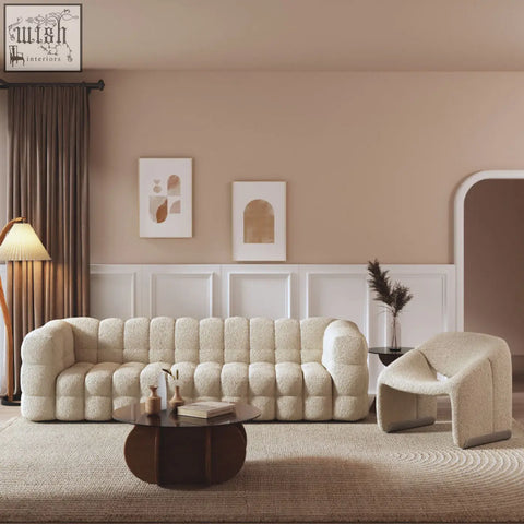 Cream-colored plush boucle bea beatrice sofa with tufted modern rounded design as two seater sofa or three seater sofa