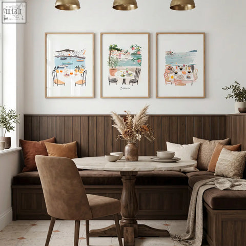 Marble-top round dining table with dark wood pedestal base complements beach art coastal mediterranean dining room wall art