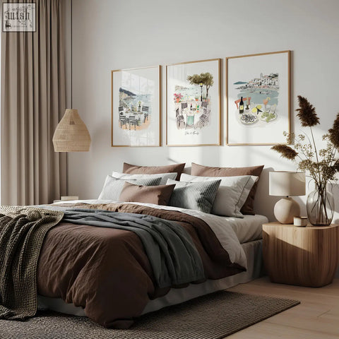 Cozy bed with earthy brown and muted gray linens and knit throws alongside amalfi coast beach artwork solo di amalfi set of 3