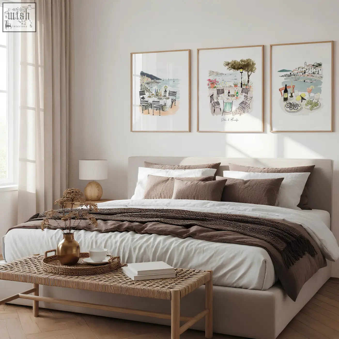 A golden metallic vase with a slender neck holding dried botanicals in solo di amalfi beach artwork set