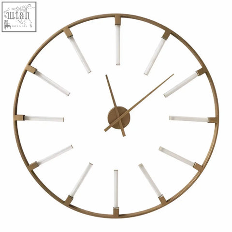 Beauly gold finish round wall clock with minimalist gold frame and slender white stick markers and matching hands
