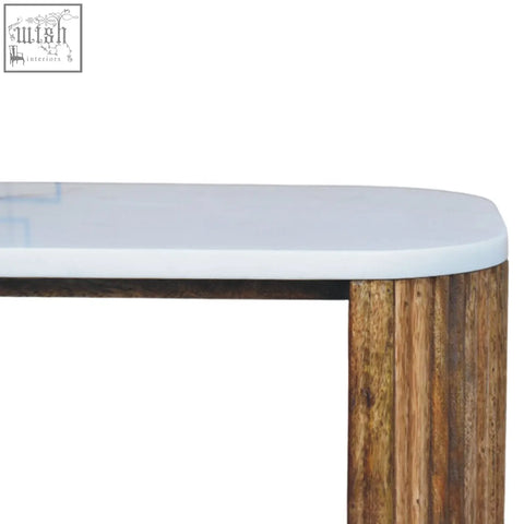 A beaumont marble bedside table with a sleek white marble effect top and solid mango wood rustic legs