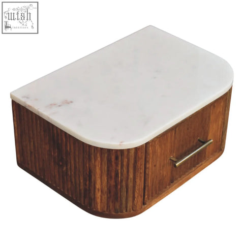 Beaumont wall-mounted bedside table with natural mango wood, white marble top, vertical slats, and brass handle