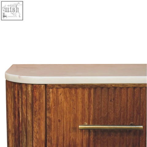 Beaumont wall-mounted bedside table with natural mango wood, vertical grooves, white marble top, and brass handle
