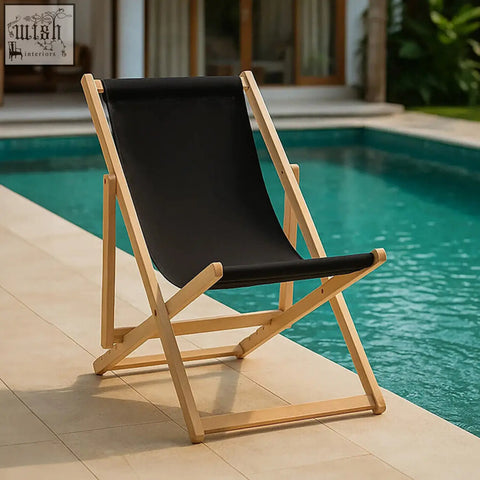 Black deck chair with light wood frame and black canvas seat perfect for outdoor lounging on your deck