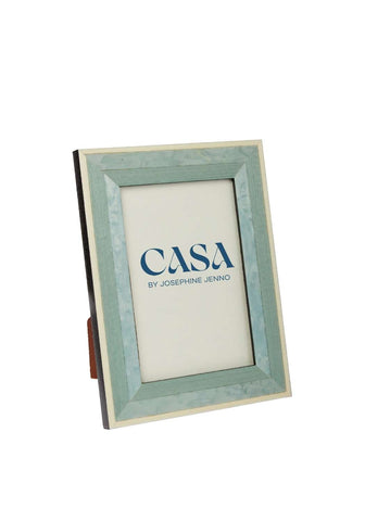 Beautiful blue marquetry photo frame with cream inner border featuring casa by josephine jenno logo in navy lettering