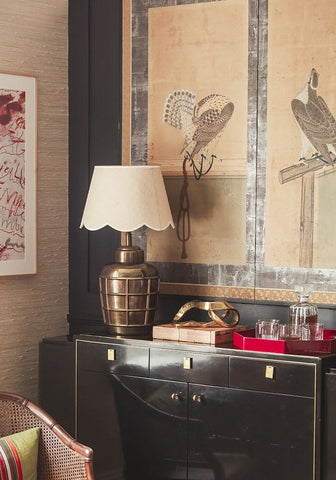 Brass table lamp with a beautifully sweet white scalloped-edge lampshade perfect for cozy lighting