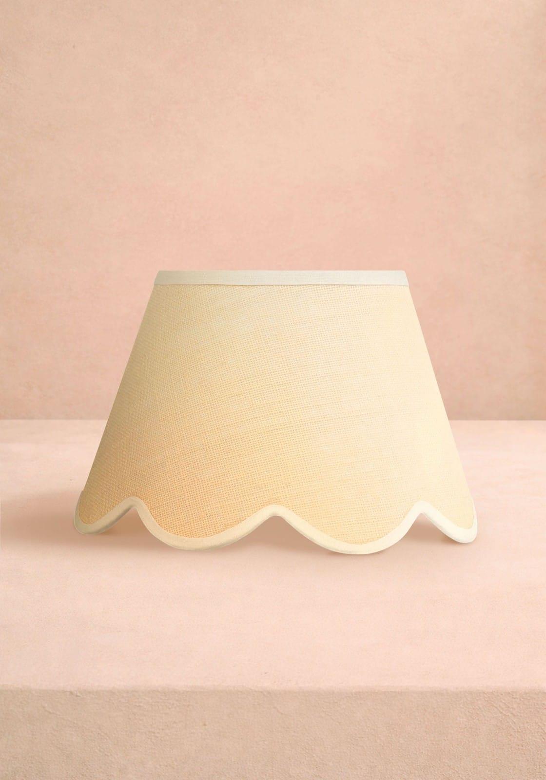Cream-colored scallop lampshade with textured fabric finish for a beautifully sweet lighting touch
