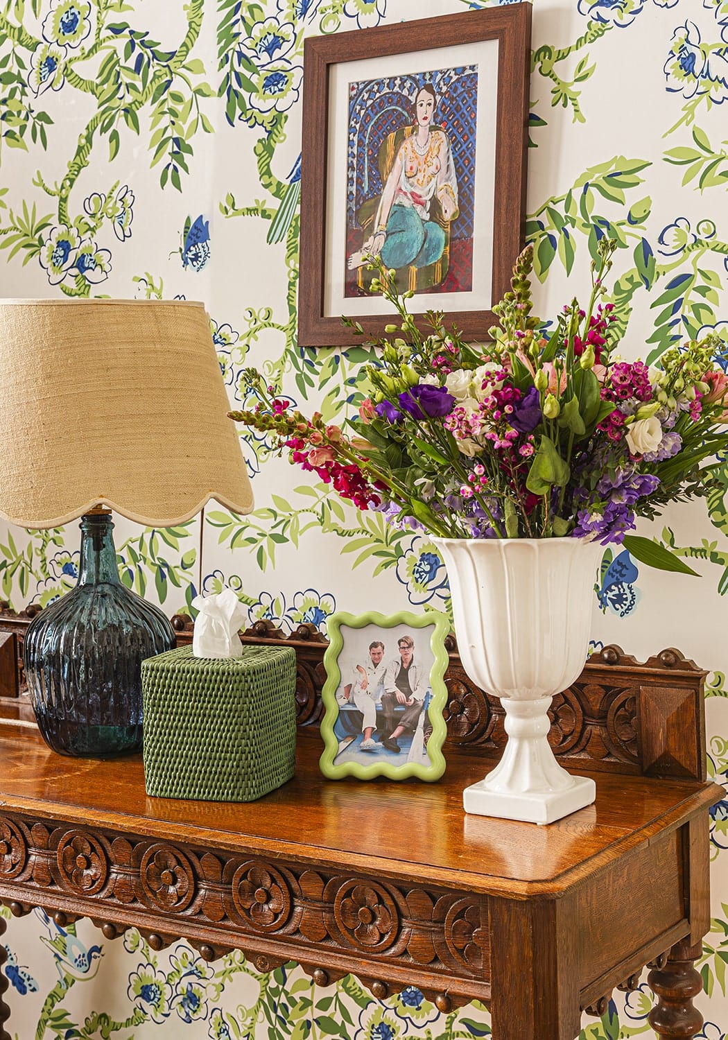 White ceramic vase with fluted sides and pedestal base paired with beautifully sweet scallop lampshade