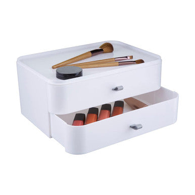 White two drawer cosmetics organiser with silver handles holding brushes and lipsticks for makeup storage