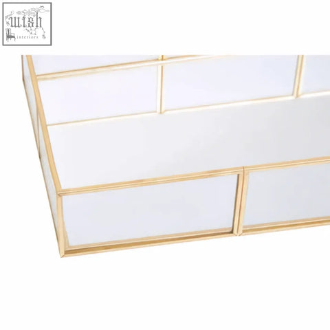 Gold-framed glass jewellery tray with a clean geometric design perfect for organizing beauty glass jewellery