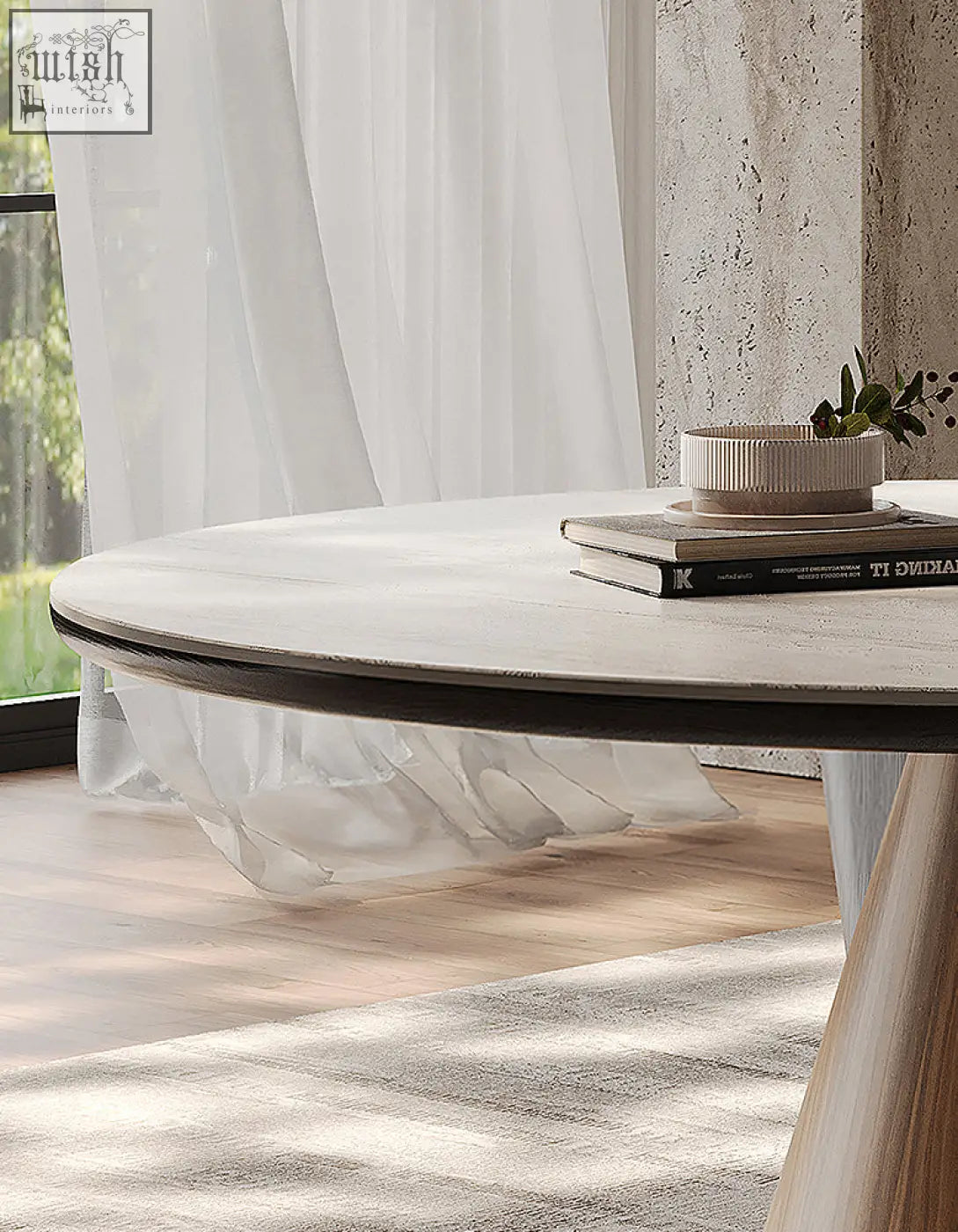 A minimalist becerra foldable round dining table with light wood finish and dark edge trim perfect for dining table use