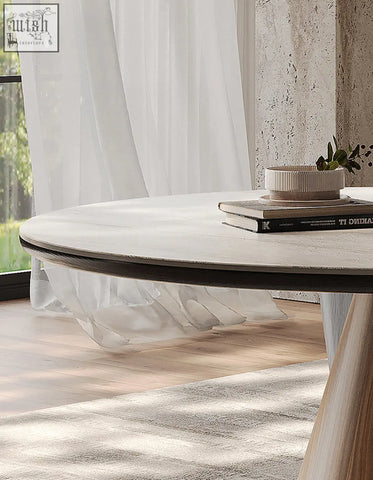 A minimalist becerra foldable round dining table with light wood finish and dark edge trim perfect for dining table use