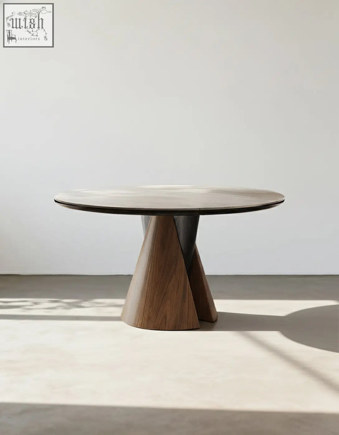 Modern round dining table with dark gray marble top and walnut wood sculptural base for stylish round dining