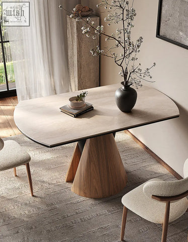 Becerra foldable round dining table with a sleek oval beige marble top and tapered wooden base for round dining