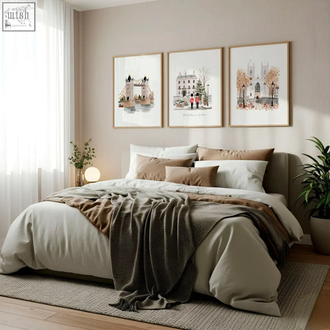 A cozy bed with soft beige and brown bedding plus dark green throw beside bedroom framed pictures wintertime in london set