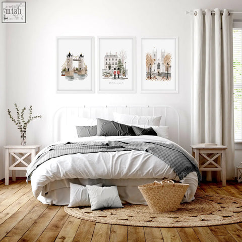 Woven natural fiber basket with handle alongside bedroom framed pictures featuring wintertime in london wall art prints