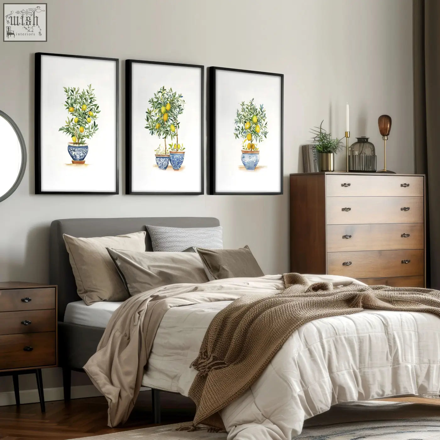 Three framed french country bedroom pictures of lemon tree prints in blue and white ceramic pots above a bed
