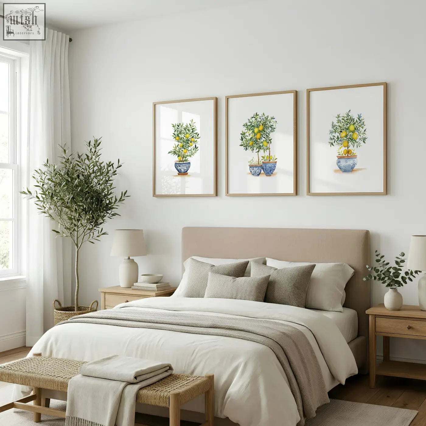 Beige upholstered bed with matching pillows and a neutral throw blanket in a french country bedroom with lemon tree art prints