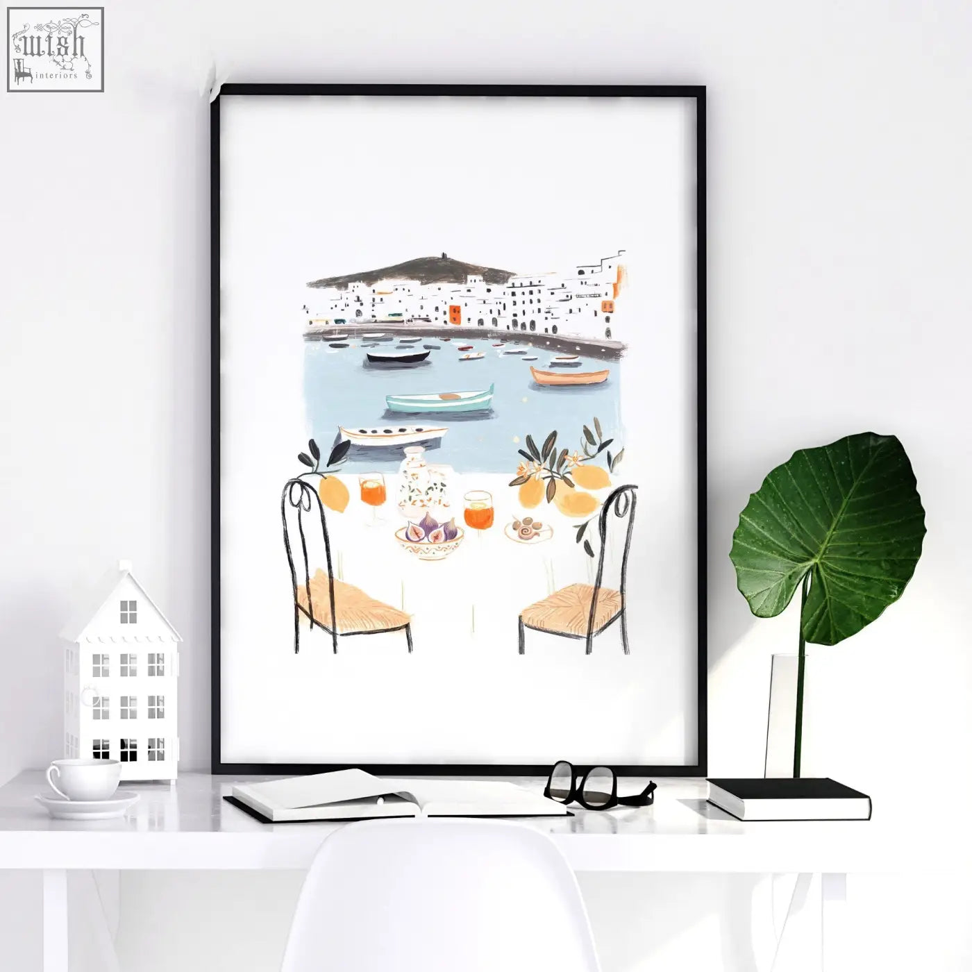 Black-framed bedroom print showing mediterranean coastal dining scene with boats capturing dolce vita vibes