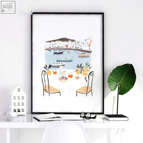 Black-framed bedroom print showing mediterranean coastal dining scene with boats capturing dolce vita vibes