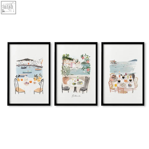Set of three black-framed bedroom prints featuring mediterranean coastal dining scene capturing dolce vita vibe