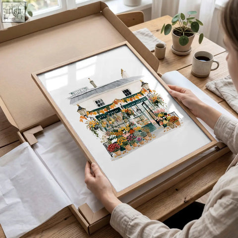 A framed flower shop illustration with vibrant blooms in a light wood frame perfect for bedroom wall frames