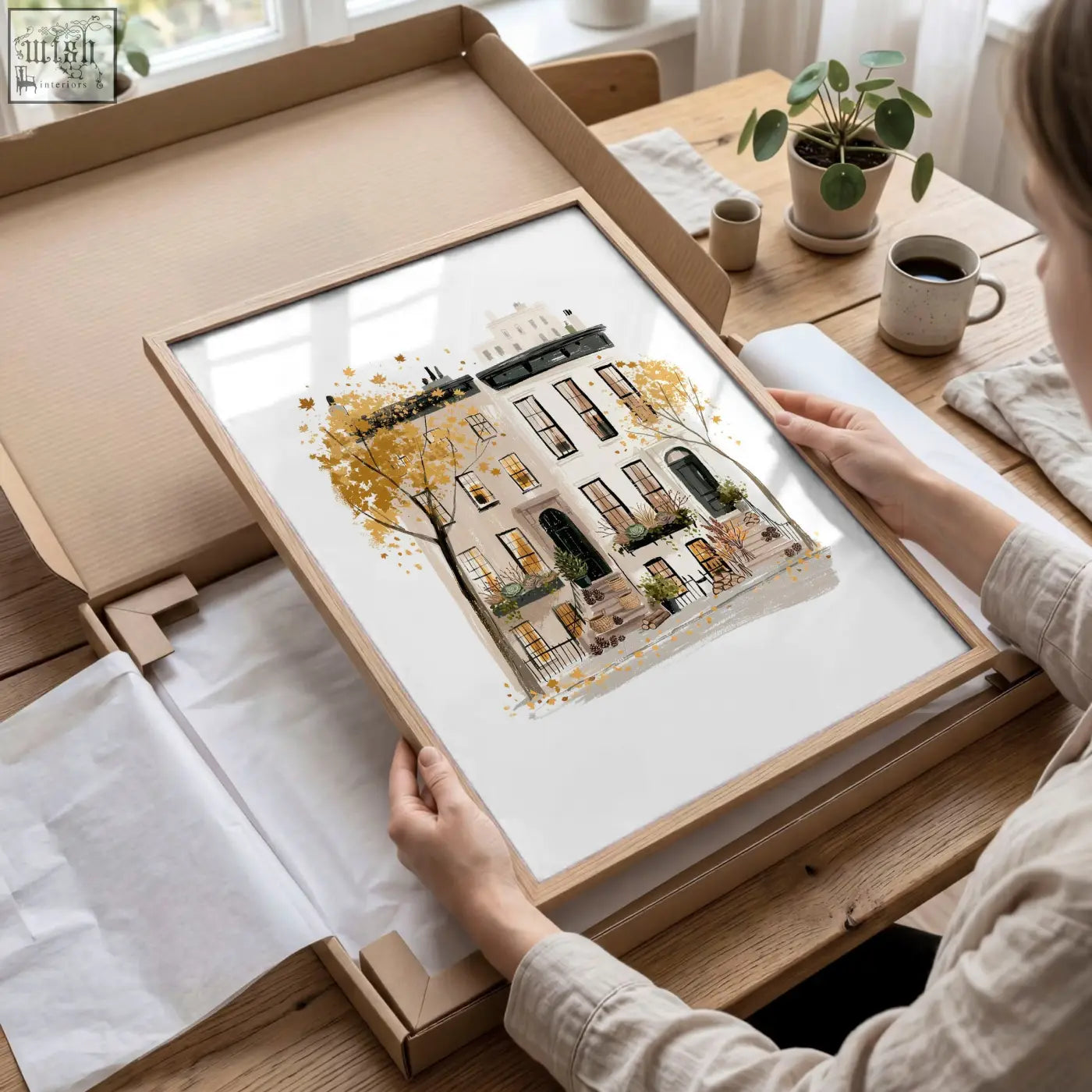 A framed watercolor art print of a york city townhouse with golden autumn leaves perfect as wall art