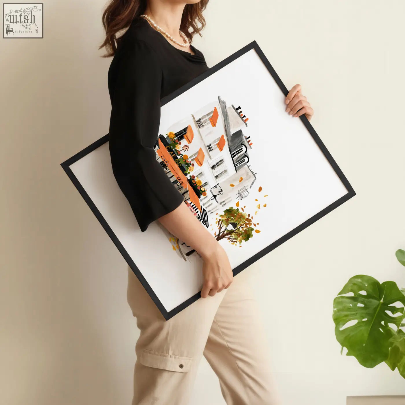 Black-framed bedroom wall pictures featuring stylized paris buildings with orange accents and autumn leaves set of 3