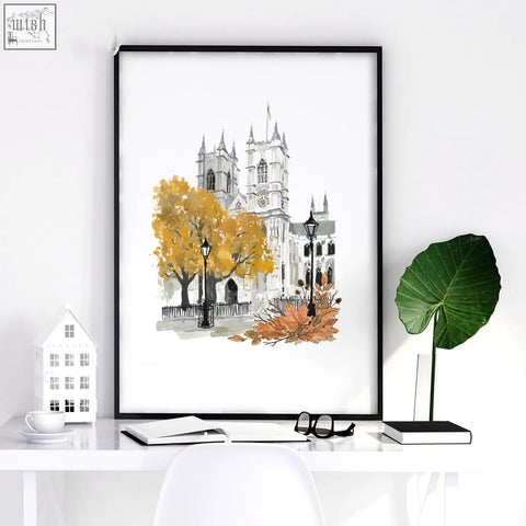 Black-framed watercolor bedroom wall picture of a parisian cathedral with autumn trees and leaves for bedroom wall decor