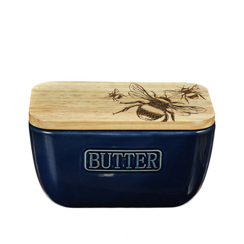 Navy blue ceramic butter dish with a light wood lid engraved with bees and butter embossed on front perfect blue butter dish