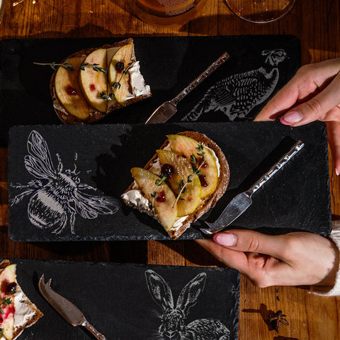 Black slate mini slate cheese board with white engraved animal designs perfect for serving cheese and snacks