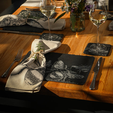Black slate place mats with white engraved bee design perfect for stylish slate place settings in a set of 2