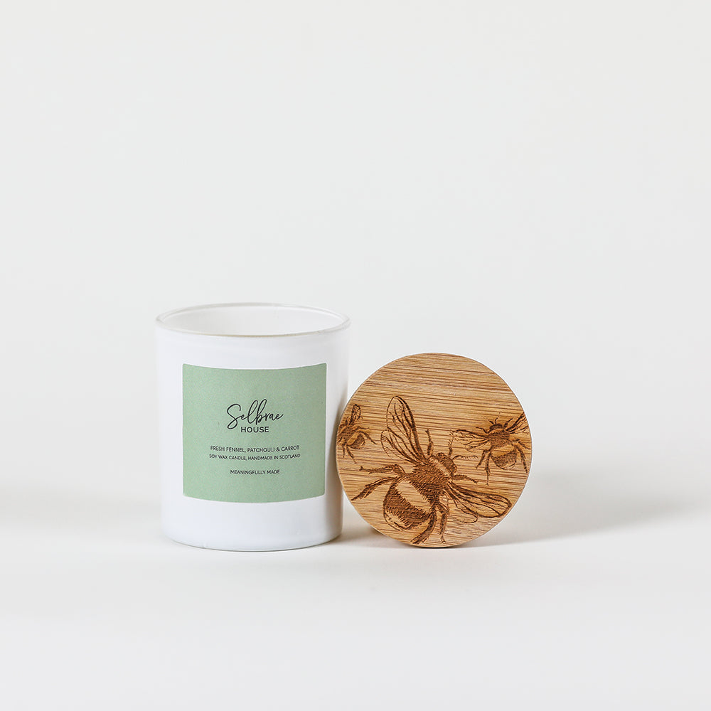 White ceramic bees fresh fennel candle jar with light green label and engraved bamboo lid featuring bees