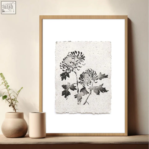 Minimalist black and white ink drawing of chrysanthemums on textured paper in a light wood frame beige wall art piece
