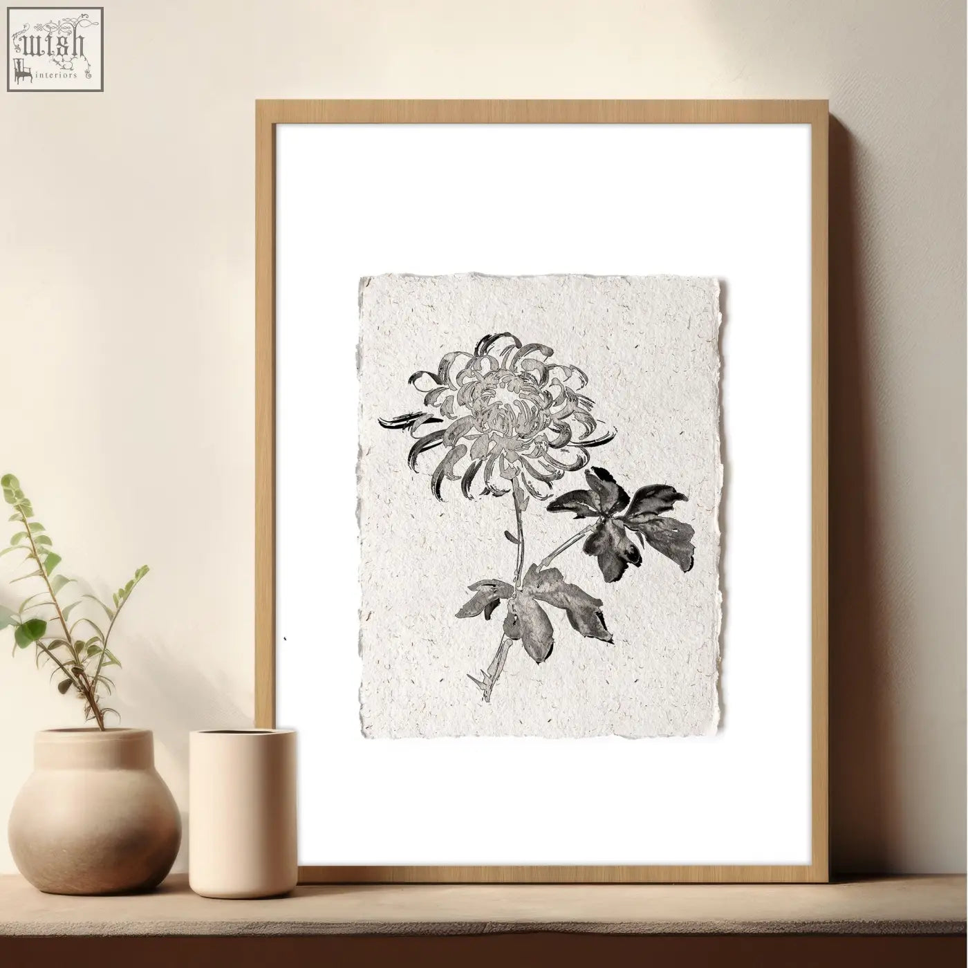 A minimalist black and white chrysanthemum ink drawing on textured paper in a light wood frame beige wall art print