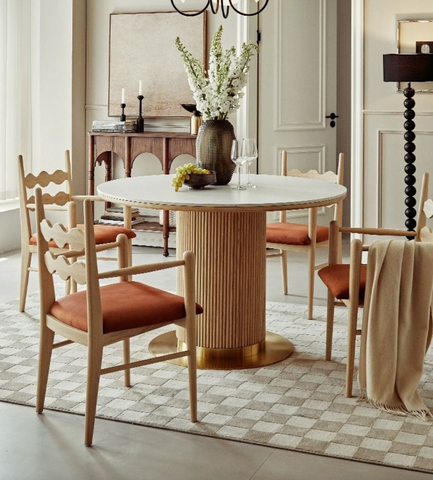 Bek round dining table with white marble top and ribbed honey wood base featuring a gold pedestal center