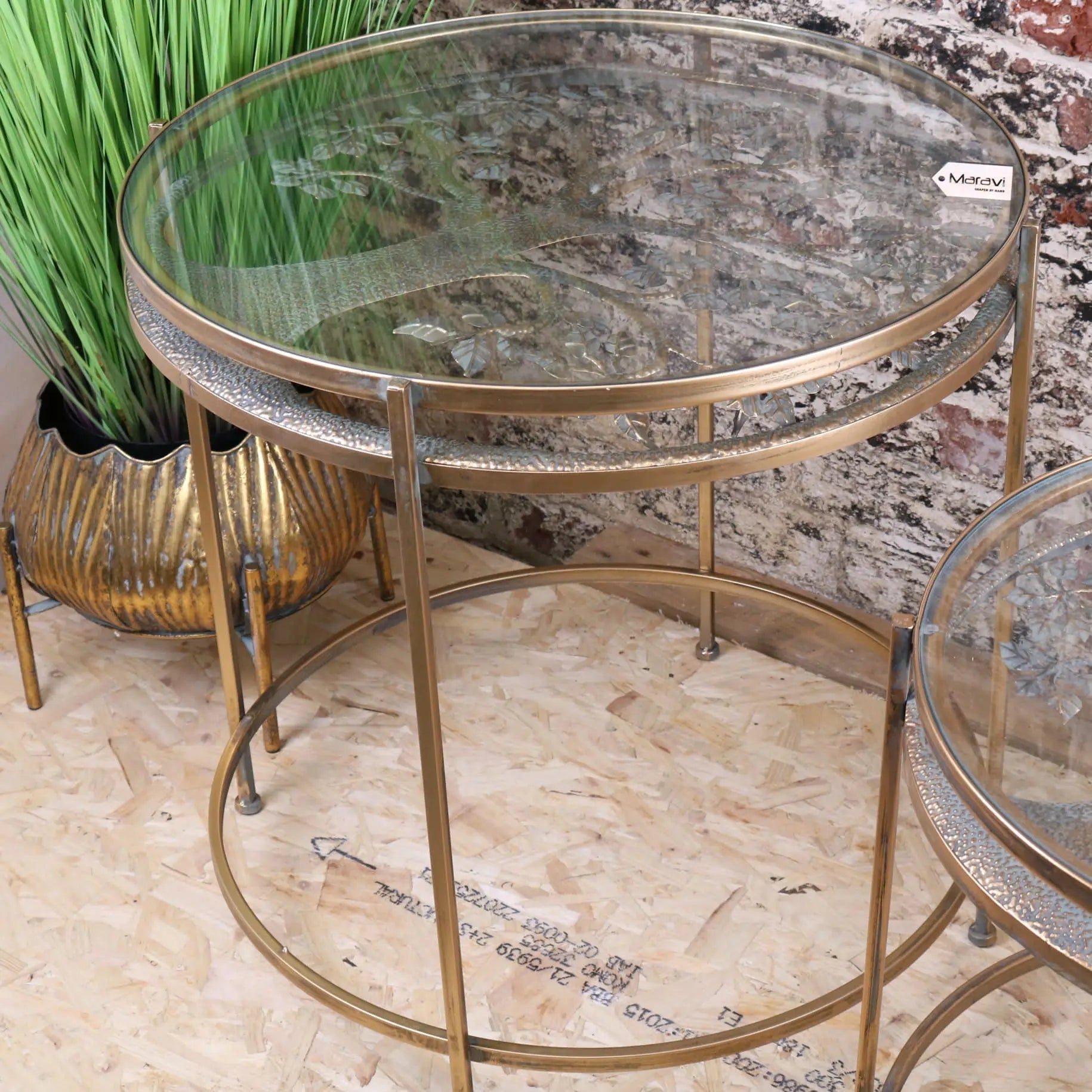 Brass belagavi gold round double-tiered nesting side tables with glass tops and mosaic trim in set of 2