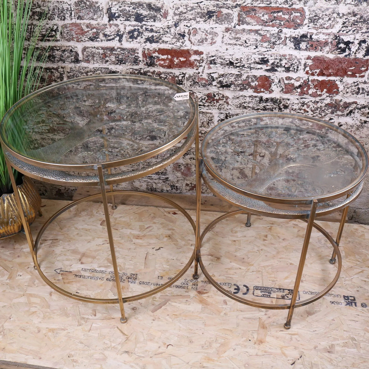 Belagavi gold round nesting side tables with brass-finished textured metallic frames and glass tops set of 2