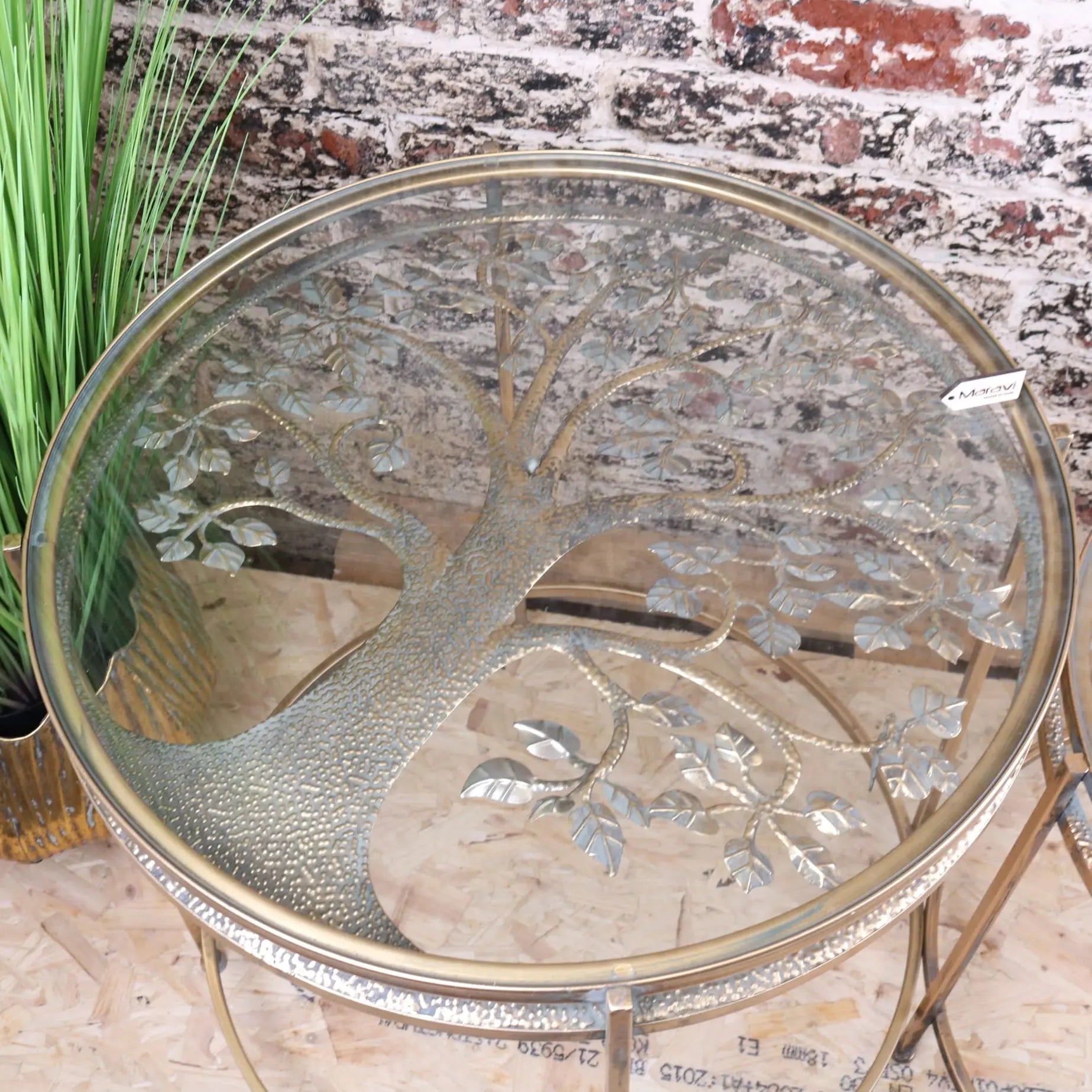Belagavi gold round side table with circular glass top and intricate metallic tree of life design in gold finish