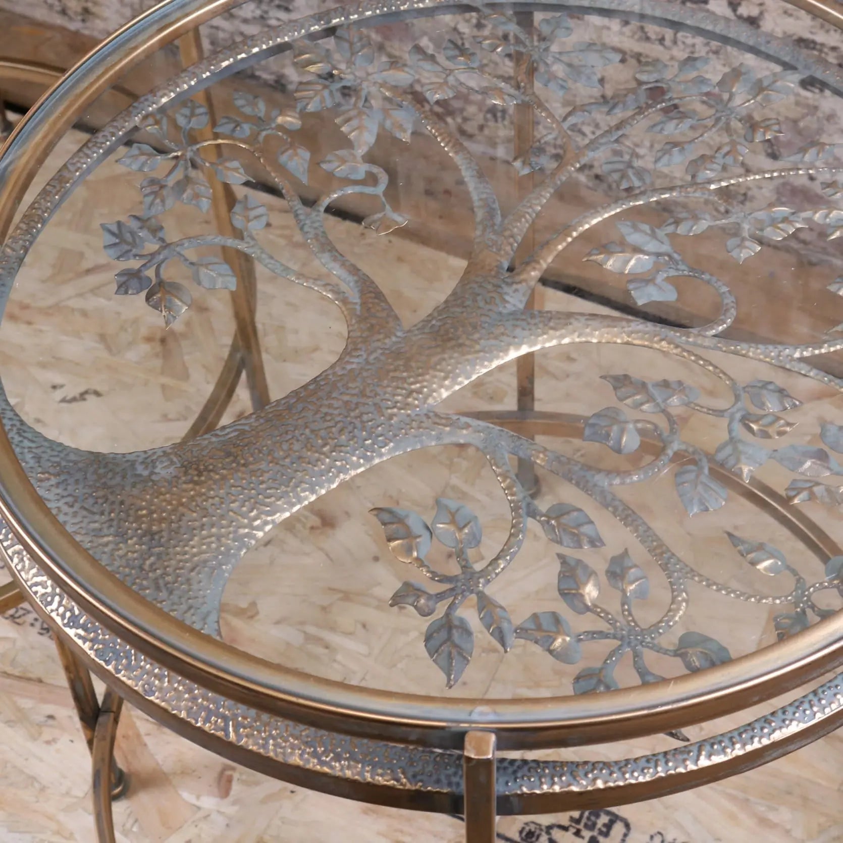 Silver-toned tree of life glass top on belagavi gold round side table with hammered texture and gold-finished legs