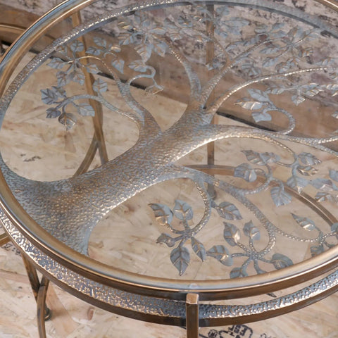 Silver-toned tree of life glass top on belagavi gold round side table with hammered texture and gold-finished legs