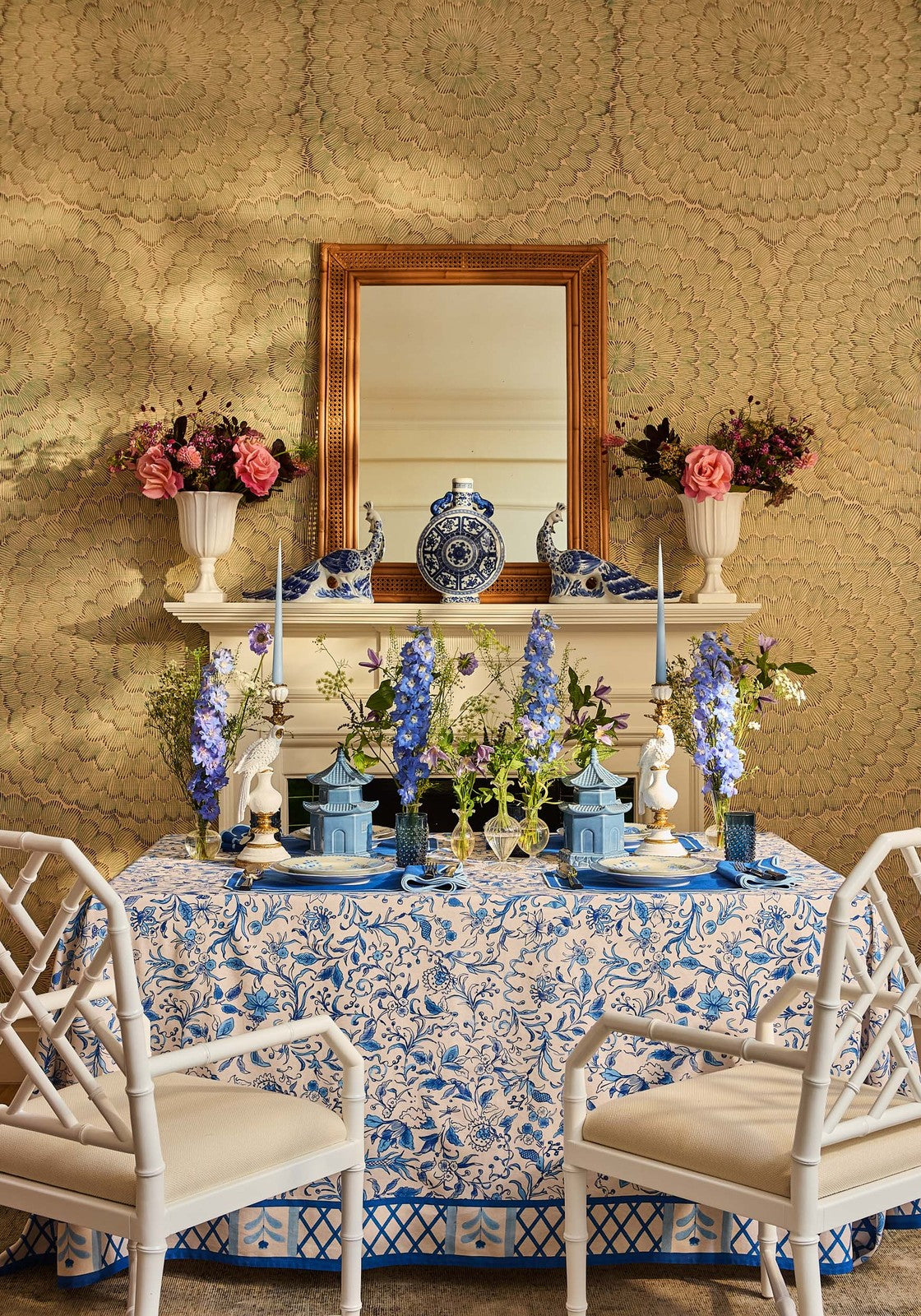 Belgravia Bloom blue cotton tablecloth with a delicate blue and white floral pattern draped over a dining table