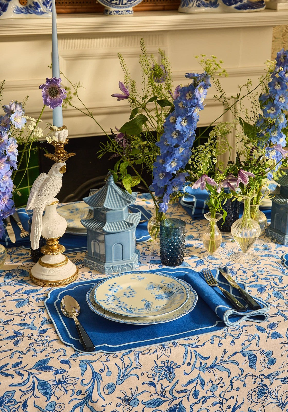 Blue and white patterned ceramic plate with delicate floral design complementing belgravia bloom tablecloth