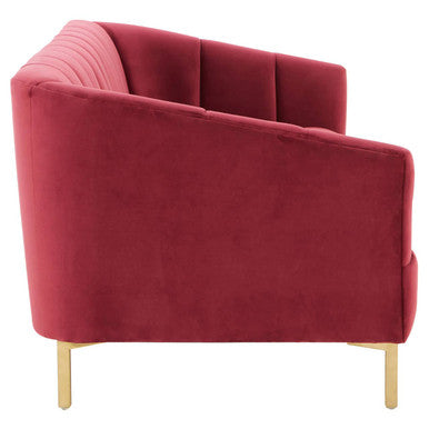 A plush deep red wine velvet sofa with tufted back panels and slender gold-tone legs perfect for stylish seating