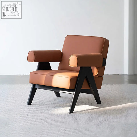 Brown bertran armchair with microfiber leather upholstery and black wooden legs in a modern minimalist design